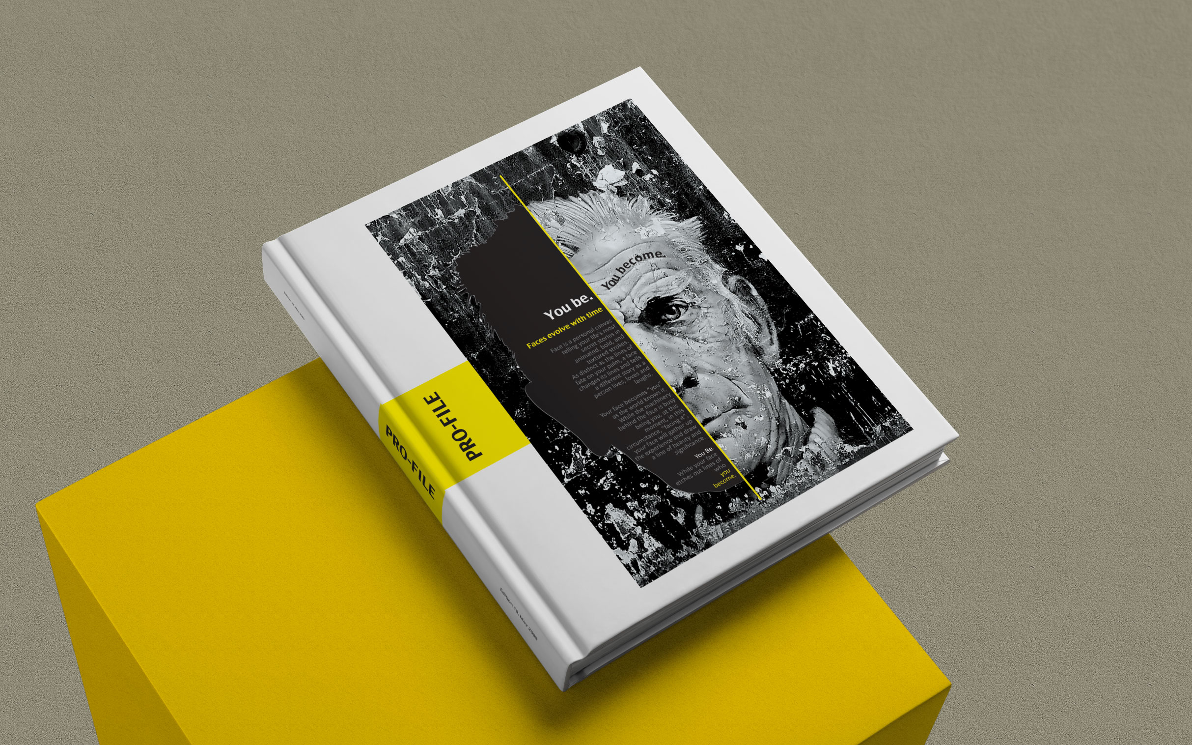 Profile book, yellow spine, on a yellow plinth